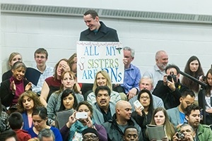 Antoni Krawiec cheering on his sisters at graduation.