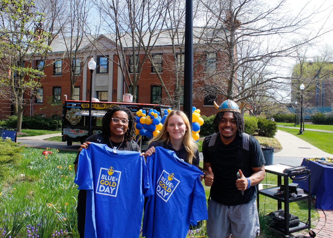 North Park Blue & Gold Day celebration 2024 three students