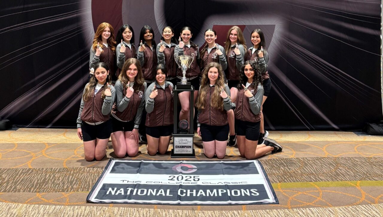North Park Dance team in front of national champion banner