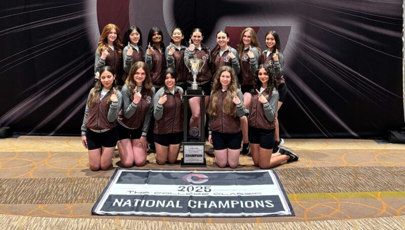 North Park Dance team in front of national champion banner