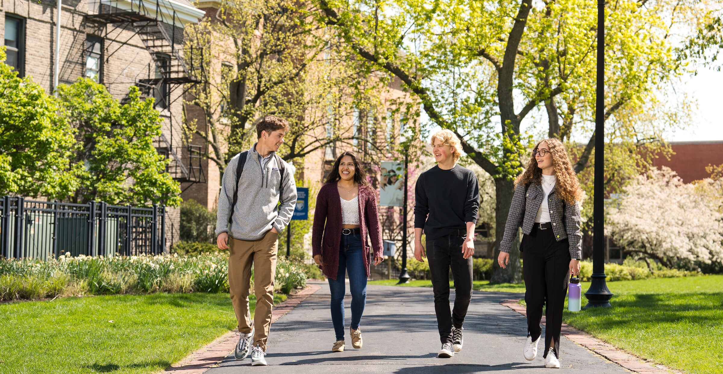 Students walk across campus near Old Main.