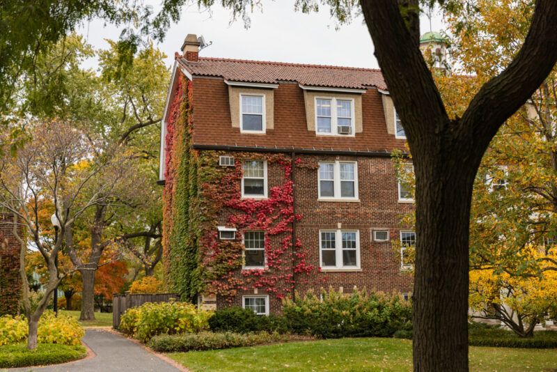 Fall campus building with ivy changing colors